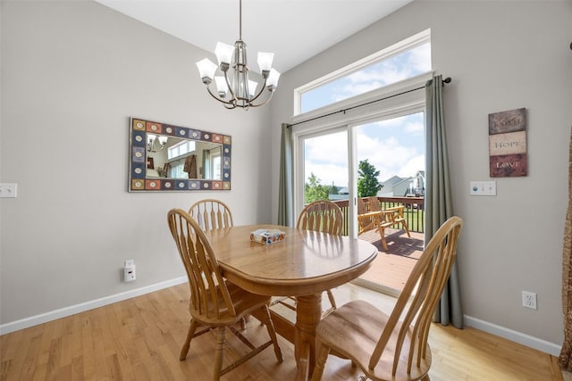 2515 Woodhill Dr SW, Cedar Rapids, IA 52404 - dining room with a chandelier and light wood-style flooring