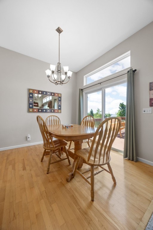 2515 Woodhill Dr SW, Cedar Rapids, IA 52404 - dining space featuring light wood-type flooring and a chandelier
