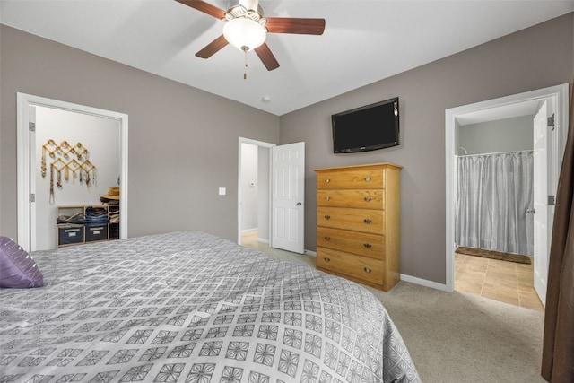 2515 Woodhill Dr SW, Cedar Rapids, IA 52404 - bedroom featuring carpet flooring, ceiling fan, and ensuite bathroom