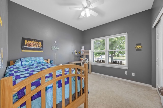 2515 Woodhill Dr SW, Cedar Rapids, IA 52404 - carpeted bedroom with a ceiling fan and a closet