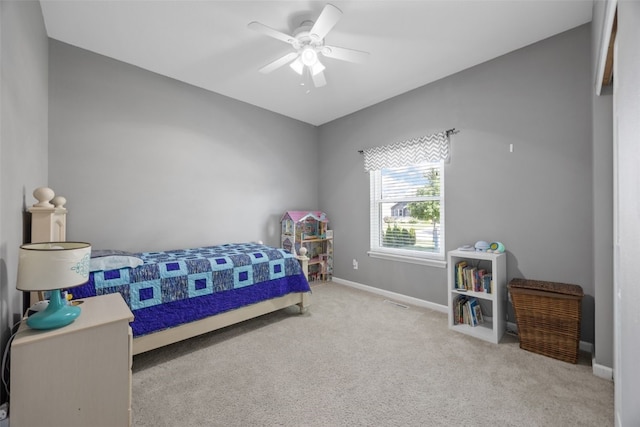 2515 Woodhill Dr SW, Cedar Rapids, IA 52404 - carpeted bedroom featuring baseboards and ceiling fan