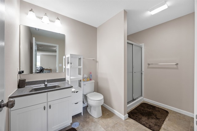 2515 Woodhill Dr SW, Cedar Rapids, IA 52404 - bathroom featuring vanity, a shower with shower door, and tile patterned flooring