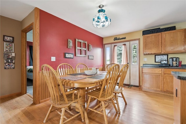 1009 W 1st St, Vinton, IA 52349 - dining area featuring light wood-style flooring