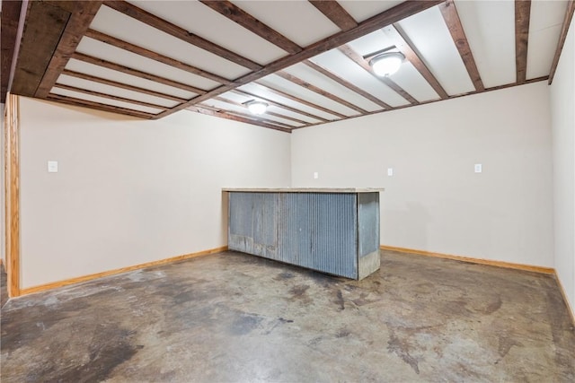 1009 W 1st St, Vinton, IA 52349 - basement featuring a bar and baseboards