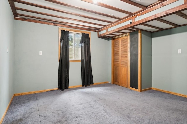 1009 W 1st St, Vinton, IA 52349 - carpeted spare room with baseboards