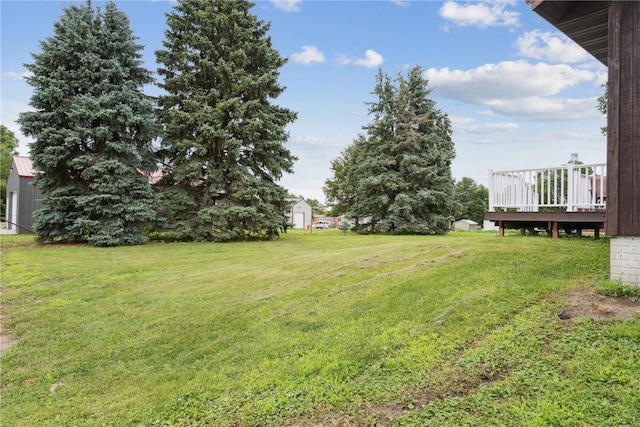 1009 W 1st St, Vinton, IA 52349 - view of green lawn with a wooden deck