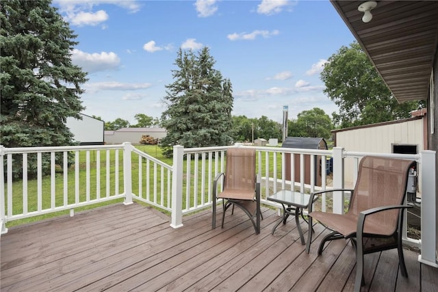 1009 W 1st St, Vinton, IA 52349 - deck with a lawn and a storage unit