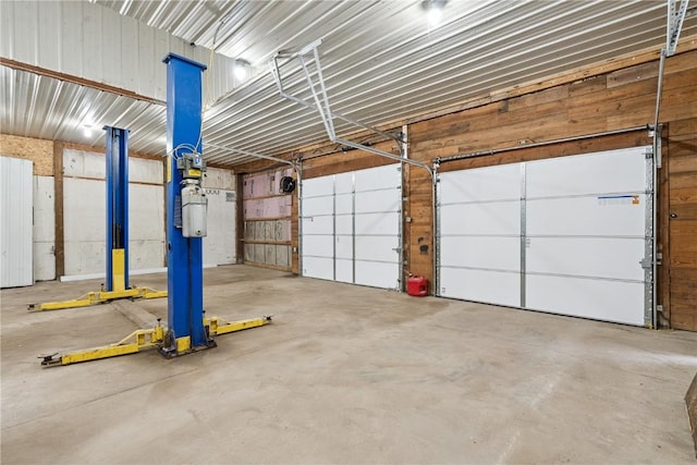 1009 W 1st St, Vinton, IA 52349 - garage featuring wood walls