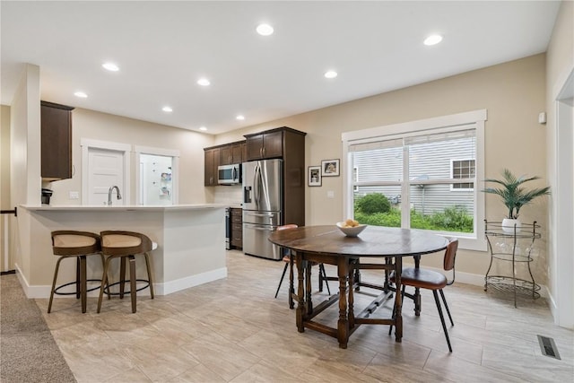 2021 Andrew Charles Dr NW, Cedar Rapids, IA 52405 - dining area with baseboards and recessed lighting