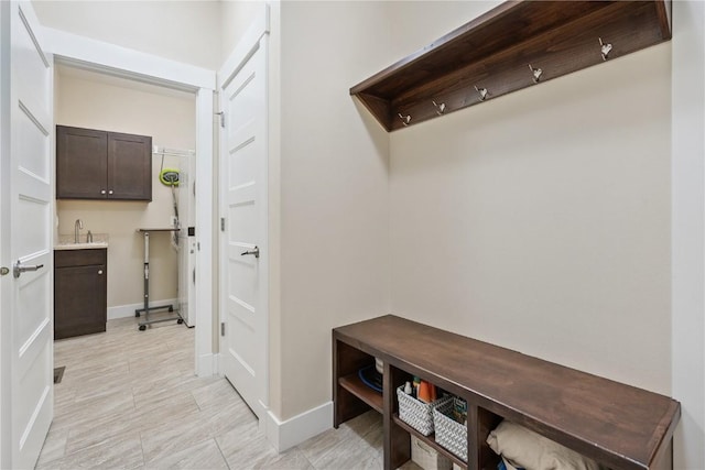 2021 Andrew Charles Dr NW, Cedar Rapids, IA 52405 - mudroom with a sink and baseboards
