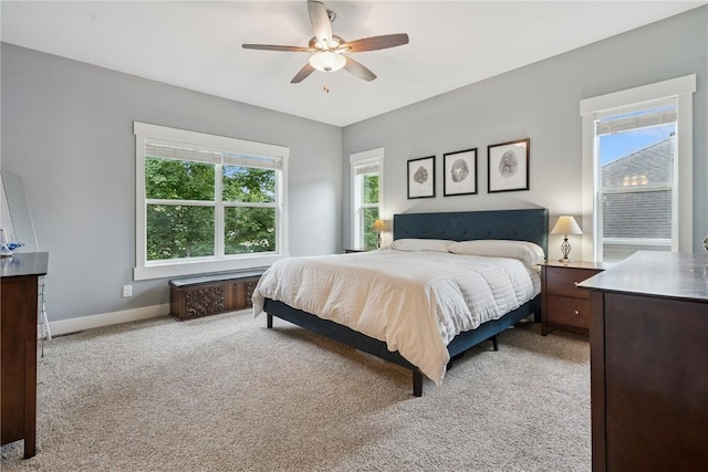 2021 Andrew Charles Dr NW, Cedar Rapids, IA 52405 - bedroom with light colored carpet and a ceiling fan