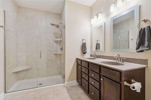 2021 Andrew Charles Dr NW, Cedar Rapids, IA 52405 - bathroom featuring a stall shower, double vanity, and tile patterned flooring