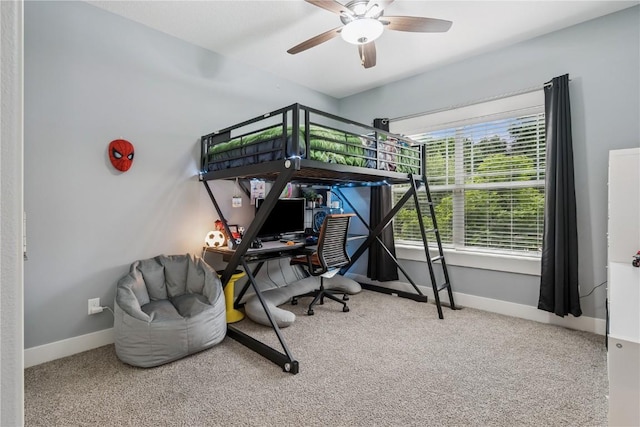 2021 Andrew Charles Dr NW, Cedar Rapids, IA 52405 - bedroom featuring carpet flooring and ceiling fan