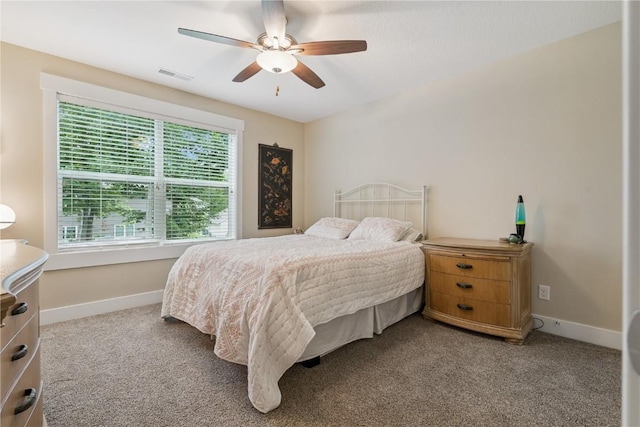 2021 Andrew Charles Dr NW, Cedar Rapids, IA 52405 - bedroom featuring carpet flooring and ceiling fan