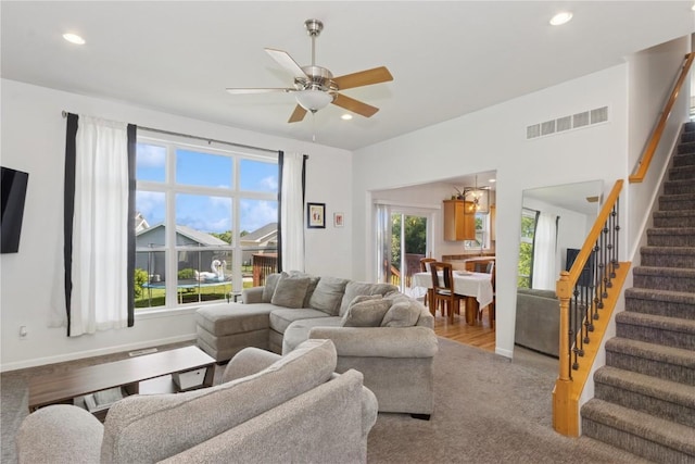 4420 Spring Meadow Pl NE, Cedar Rapids, IA 52411 - living room with stairs, a ceiling fan, and recessed lighting