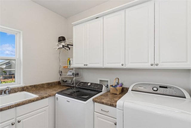 4420 Spring Meadow Pl NE, Cedar Rapids, IA 52411 - laundry area featuring cabinet space, washer and clothes dryer, and plenty of natural light
