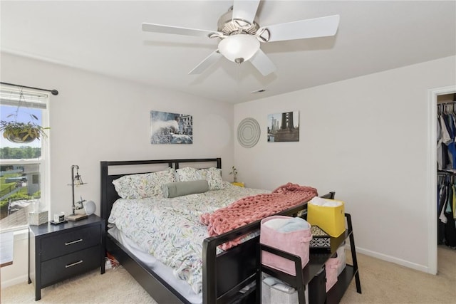 4420 Spring Meadow Pl NE, Cedar Rapids, IA 52411 - bedroom with light colored carpet, a spacious closet, a closet, and ceiling fan
