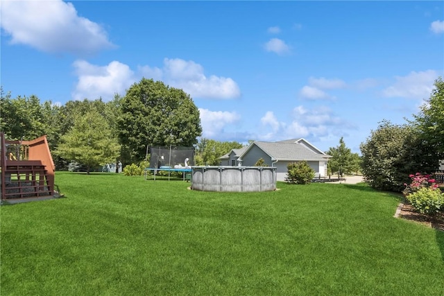 4420 Spring Meadow Pl NE, Cedar Rapids, IA 52411 - view of green lawn featuring a covered pool and a trampoline