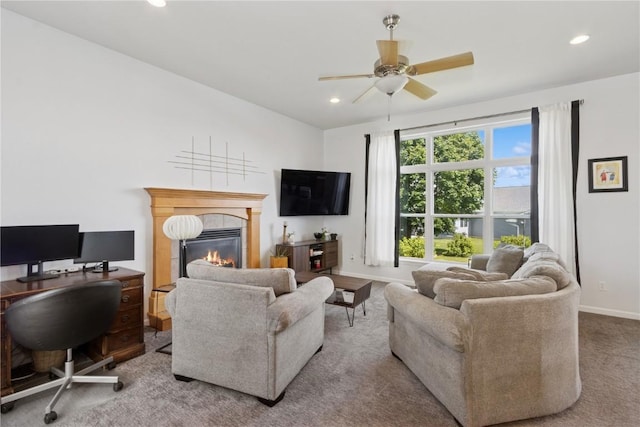 4420 Spring Meadow Pl NE, Cedar Rapids, IA 52411 - living room with a glass covered fireplace, a ceiling fan, an office area, recessed lighting, and carpet