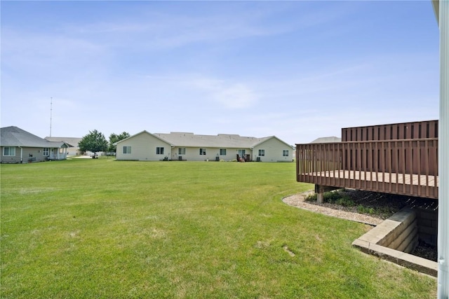 1019 Acacia Dr NE, Cedar Rapids, IA 52402 - view of grassy yard featuring a wooden deck and a residential view