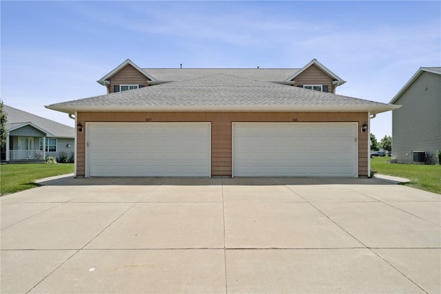1019 Acacia Dr NE, Cedar Rapids, IA 52402 - view of front of home with a shingled roof, a garage, and driveway