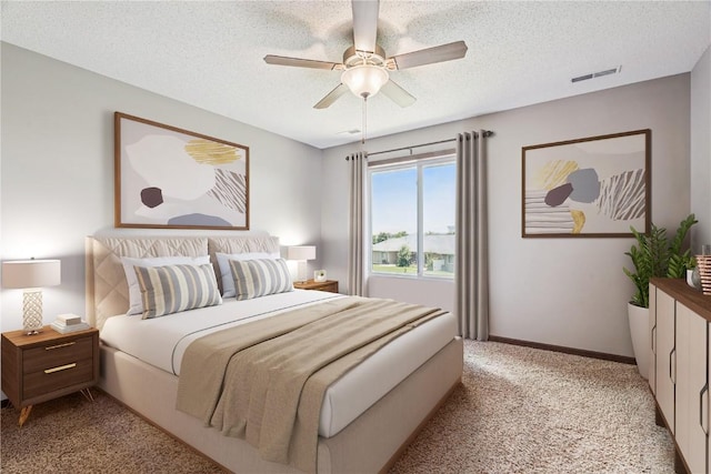 1019 Acacia Dr NE, Cedar Rapids, IA 52402 - bedroom with light colored carpet, a textured ceiling, and ceiling fan