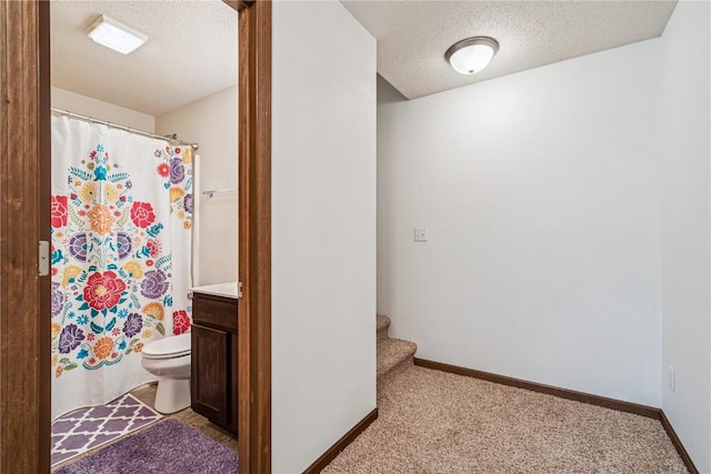 1019 Acacia Dr NE, Cedar Rapids, IA 52402 - bathroom with a textured ceiling, vanity, and a shower with curtain
