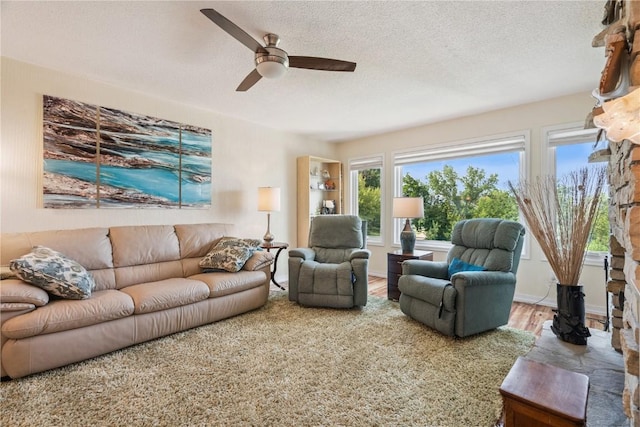 1580 Matterhorn Dr NE, Cedar Rapids, IA 52402 - living room with ceiling fan, wood finished floors, and a textured ceiling