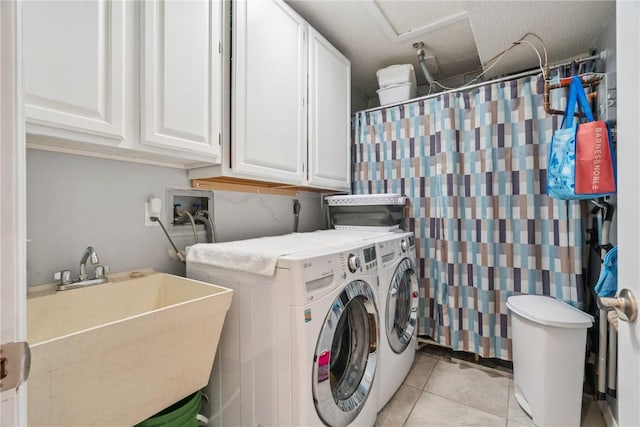 1580 Matterhorn Dr NE, Cedar Rapids, IA 52402 - washroom with washing machine and clothes dryer, cabinet space, and light tile patterned floors