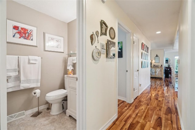 1580 Matterhorn Dr NE, Cedar Rapids, IA 52402 - hallway with baseboards and light wood-style flooring