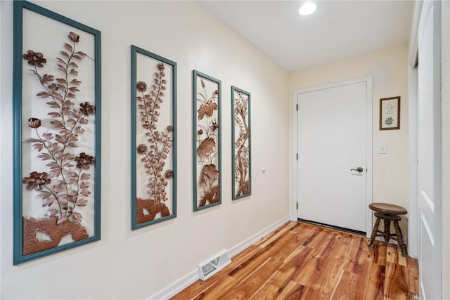 1580 Matterhorn Dr NE, Cedar Rapids, IA 52402 - doorway to outside featuring light wood-style floors and recessed lighting