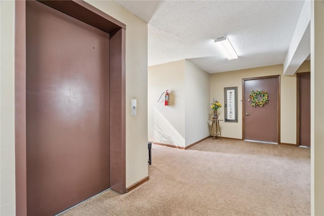 1580 Matterhorn Dr NE, Cedar Rapids, IA 52402 - carpeted foyer with elevator and a textured ceiling