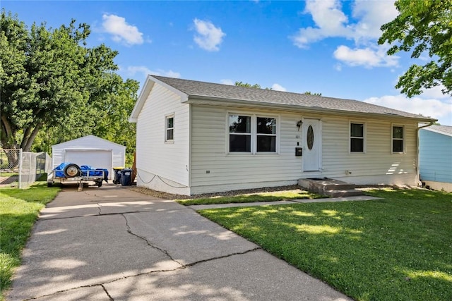 105 E Clark St, Hiawatha, IA 52233 - view of front of property featuring a detached garage and an outbuilding