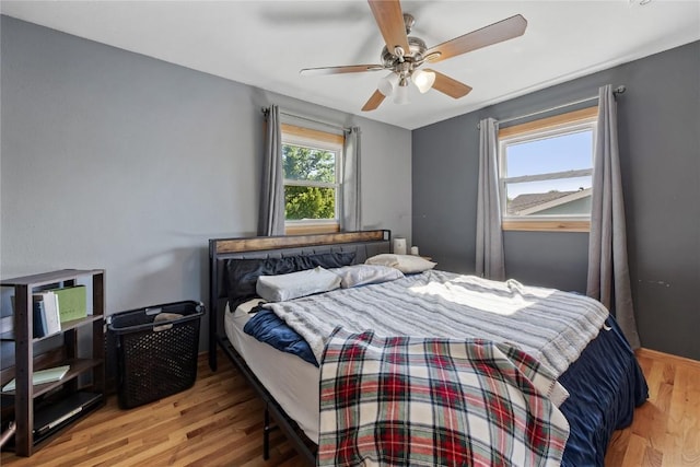 105 E Clark St, Hiawatha, IA 52233 - bedroom with wood finished floors and ceiling fan