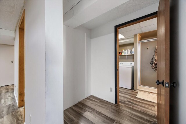 105 E Clark St, Hiawatha, IA 52233 - hallway featuring washer / clothes dryer and wood finished floors