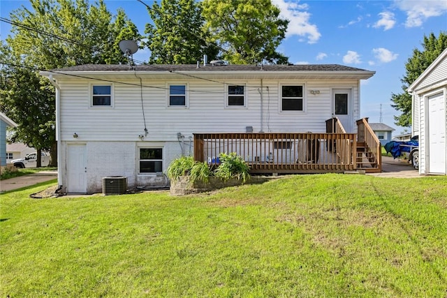 105 E Clark St, Hiawatha, IA 52233 - back of property featuring a yard, brick siding, and a deck