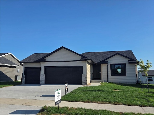 6188 Cope Dr, Marion, IA 52302 - ranch-style home with a garage, a front lawn, concrete driveway, and roof with shingles