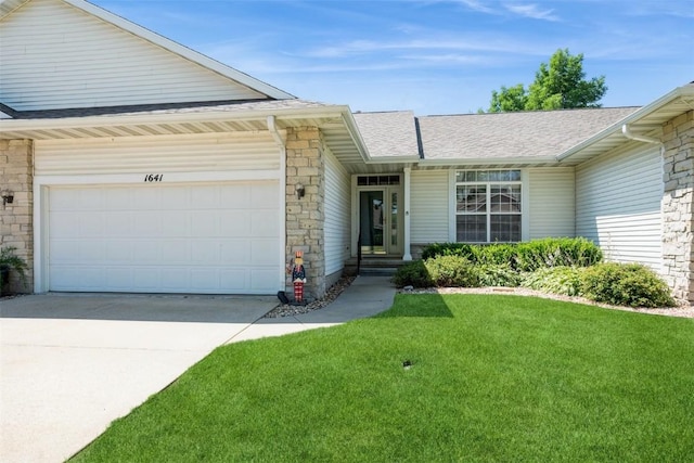 1641 Greens Way Ct, Cedar Rapids, IA 52402 - view of front of house with roof with shingles, stone siding, driveway, a front yard, and a garage