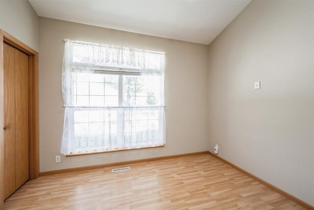 1641 Greens Way Ct, Cedar Rapids, IA 52402 - unfurnished bedroom with light wood-style flooring and a closet