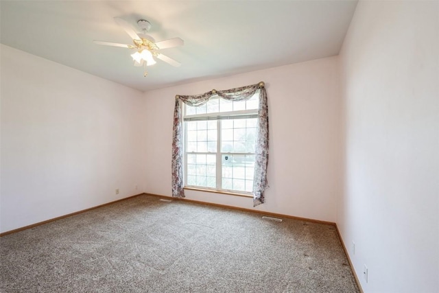 1641 Greens Way Ct, Cedar Rapids, IA 52402 - carpeted empty room featuring baseboards and a ceiling fan