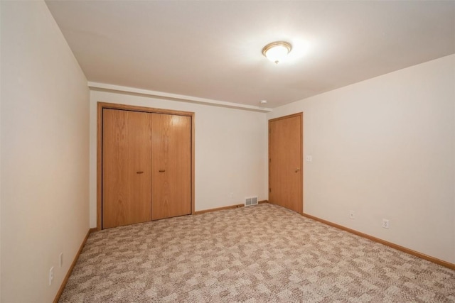 1641 Greens Way Ct, Cedar Rapids, IA 52402 - unfurnished bedroom with a closet and carpet floors