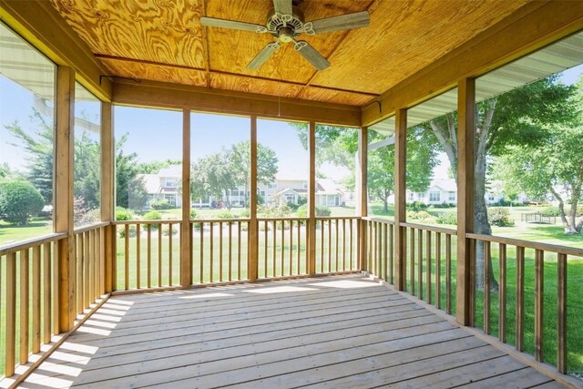 1641 Greens Way Ct, Cedar Rapids, IA 52402 - unfurnished sunroom with ceiling fan and a residential view