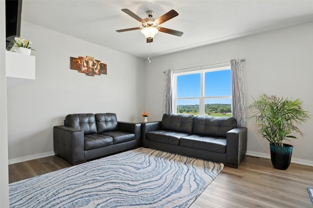 717 E Bear Dr, Tiffin, IA 52340 - living room featuring wood finished floors and a ceiling fan