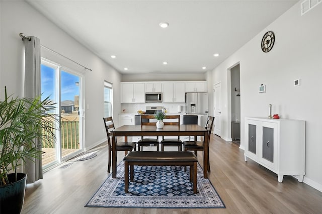 717 E Bear Dr, Tiffin, IA 52340 - dining area featuring light wood-style floors and recessed lighting