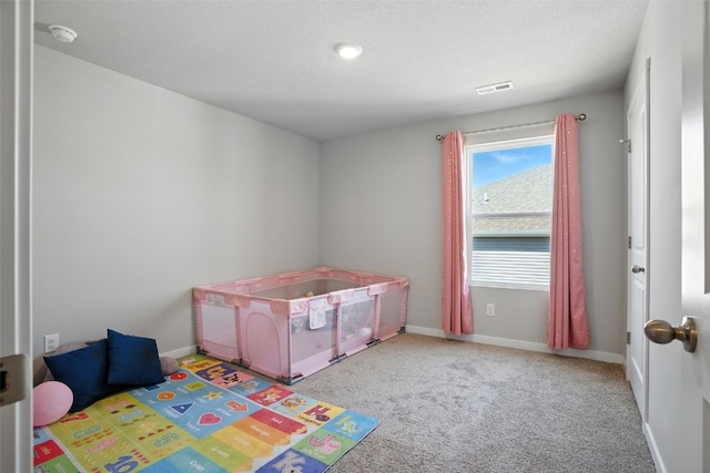 717 E Bear Dr, Tiffin, IA 52340 - recreation room featuring baseboards and carpet floors