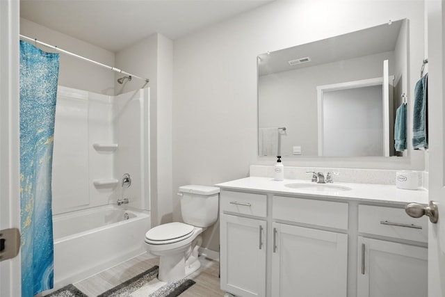 717 E Bear Dr, Tiffin, IA 52340 - bathroom featuring vanity, shower / bathtub combination with curtain, and wood finished floors