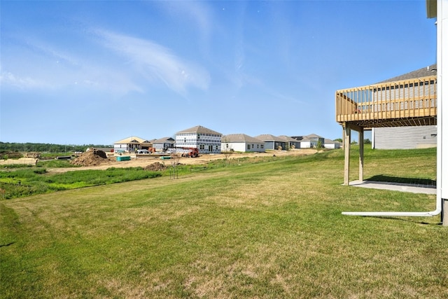 717 E Bear Dr, Tiffin, IA 52340 - view of green lawn featuring a wooden deck