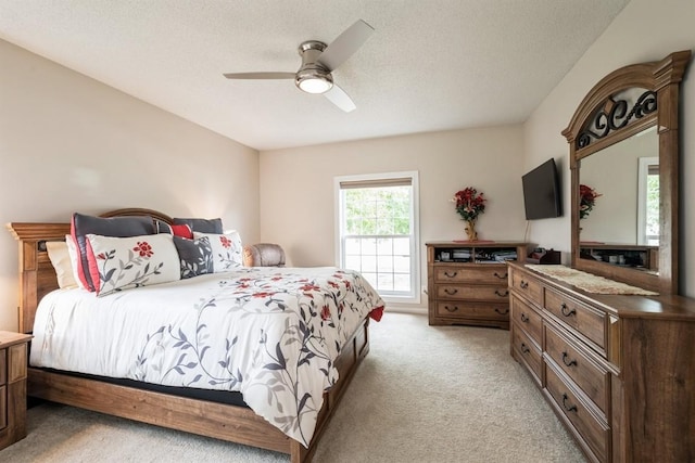 4405 Westchester Dr Unit B, Cedar Rapids, IA 52402 - bedroom with light carpet, ceiling fan, and a textured ceiling