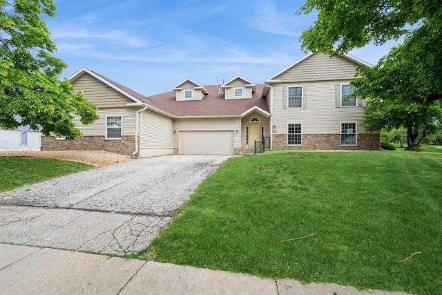 4405 Westchester Dr Unit B, Cedar Rapids, IA 52402 - view of front of house featuring asphalt driveway, an attached garage, and a front lawn