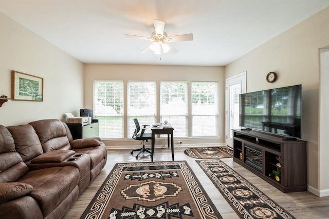 4405 Westchester Dr Unit B, Cedar Rapids, IA 52402 - living area with ceiling fan, plenty of natural light, a desk, and light wood-style floors